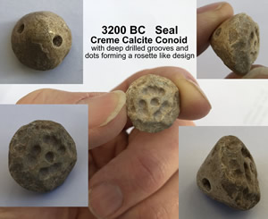 3200 BC Crème Calcite Conoid Stamp Seal with deep drilled grooves and dots forming a rosette design
