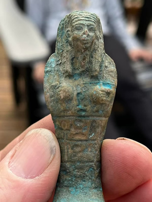 Turquoise blue glazed pottery faience Ushabti figure with hieroglyphic panels on the front from Egypt