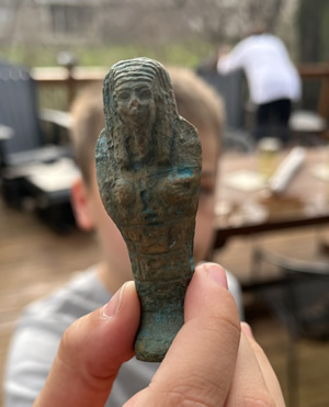 Turquoise blue glazed pottery faience Ushabti figure with hieroglyphic panels on the front from Egypt