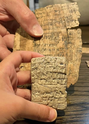 Cuneiform_ceramic_tablet_2500-1000_BC_and_Papyrus_250-100_BC