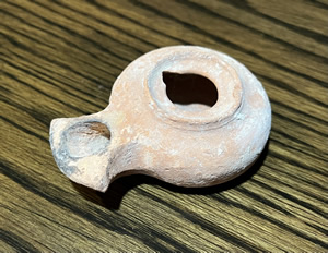 Used around 30 AD a Herodian oil lamp with a design produced from 63 BC – 200 AD