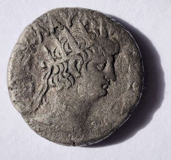 Silver coin minted by Nero 54-68 AD in Alexandria, Egypt. Nero wears a radiant, mult-pinted crown, a symbol of diety