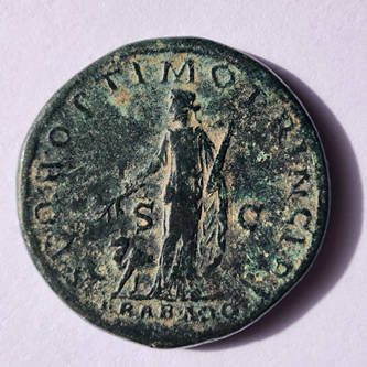 Reverse side of Trajan coin with Arabia Stands inscribed "ARAB ADQVIS"