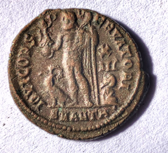 Reverse side of Licinius II coin with god Jupiter standing between an Eagle and a captive