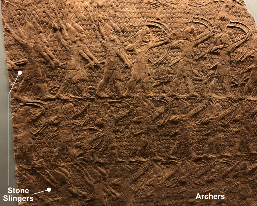 Assyrian stone slingers and archers attack Lachish 