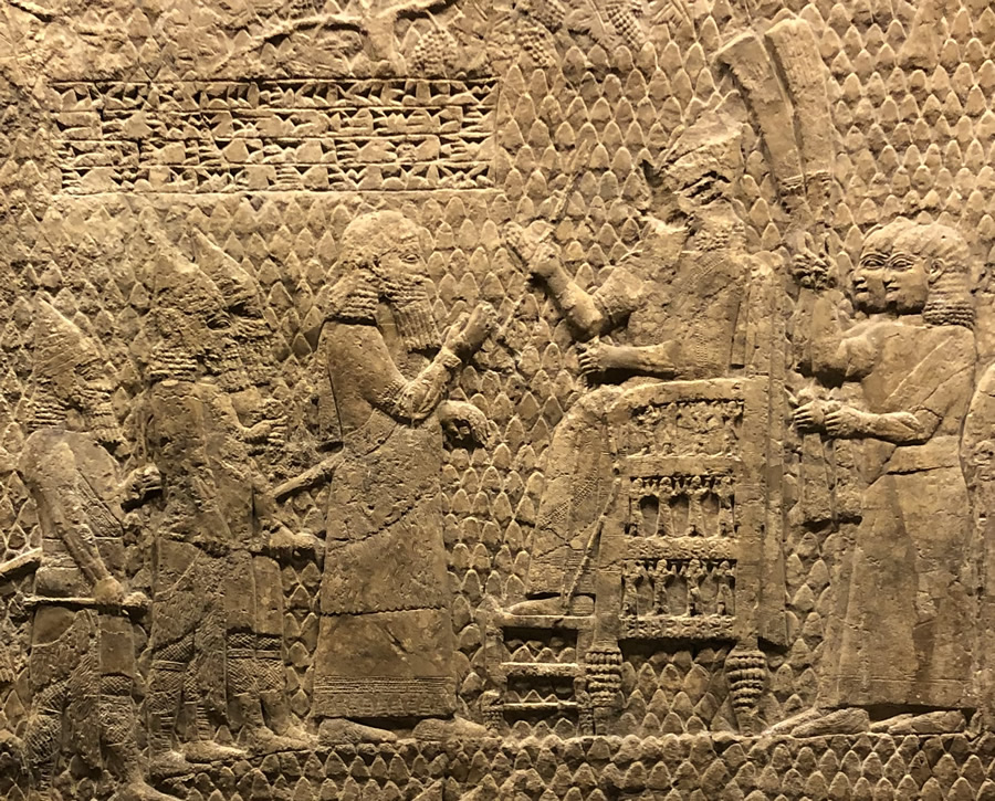 Sennacherib on his throne outside of Lachish judging the rebellious leaders of the Hebrews