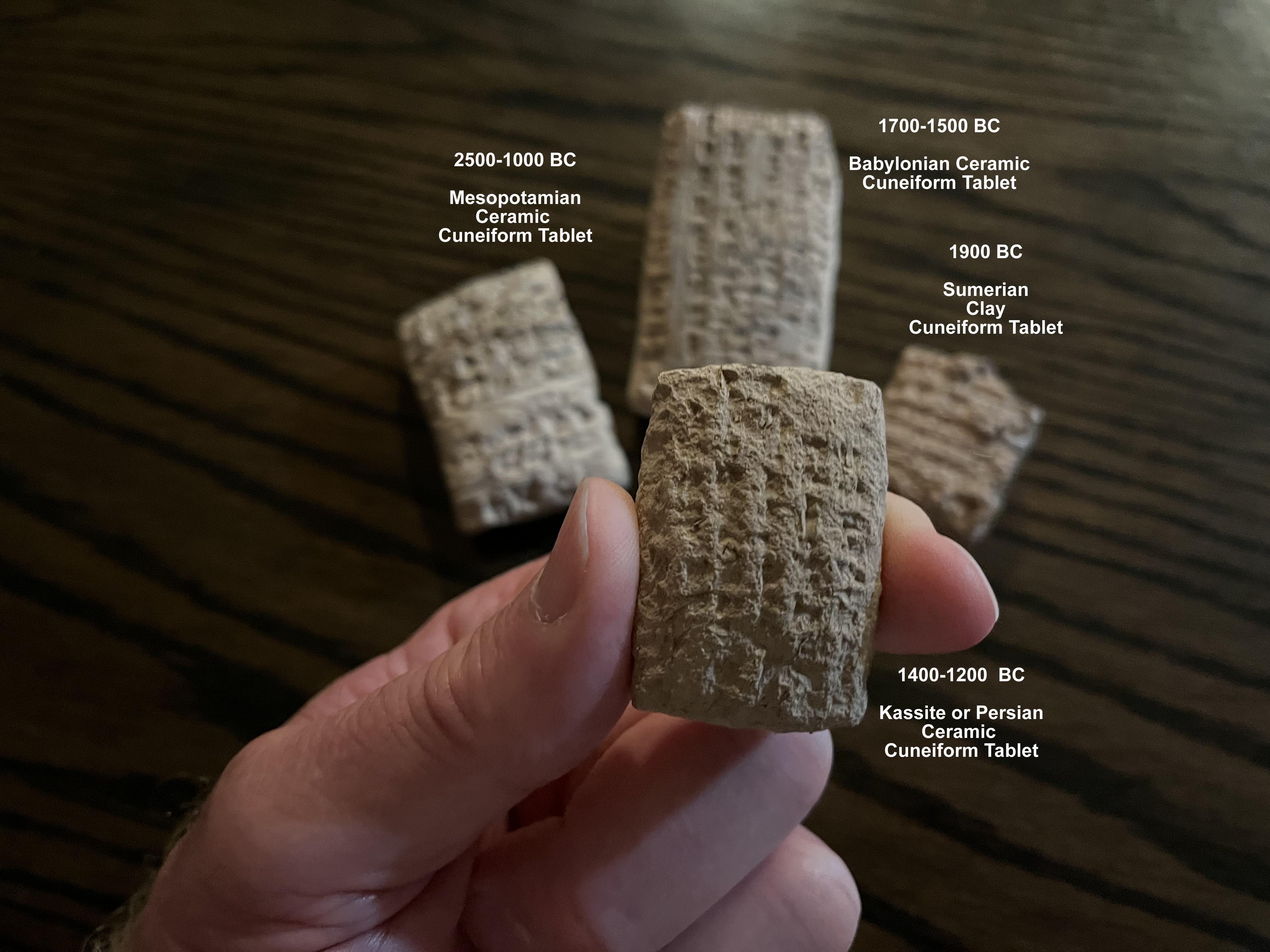four cuneiform tablets 2500 1200 BC in hand